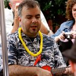 Man participating in ukulele jam session